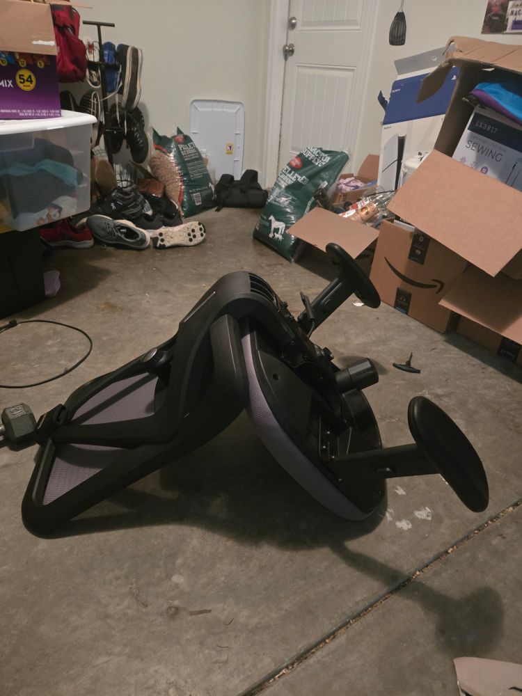 An idiot made, half assembled rolling office chair. The armrests were screwed on upside down by a fool