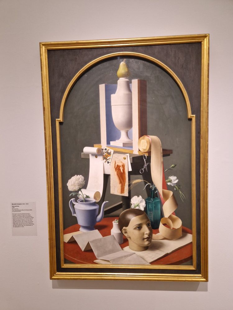 Just a huge variety of objects arranged as a still life all cryptic with meaning