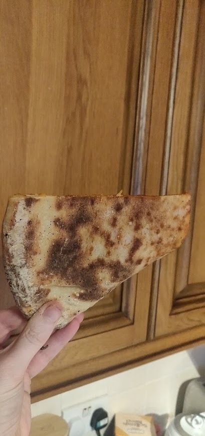 Pizza slice folded to show undercarriage