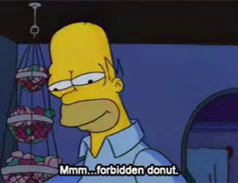 a cartoon of homer simpson says " mmmm forbidden donut "