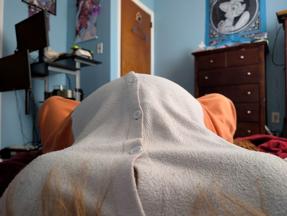 A first person view of me laying on my back, my legs spread wide yet only my orange knees just barely visible by the sides of that round, enormous belly. My ample breasts dwarfed by the sheet size of that balloon gut~