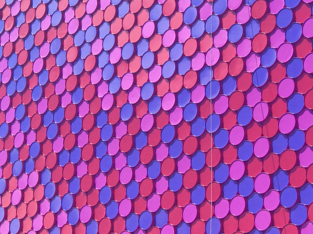 Hundreds of stacked oil drums. A cropped photograph of Christo and Jeanne-Claude's floating sculpture “The London Mastaba.” The Serpentine, Hyde Park, London, UK. Photo by Gearóid Burke, June 2018.