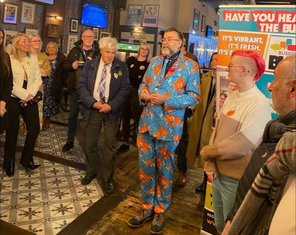 Host Paul Horne dressed in his trademark Goldfish suit,  greeting everyone at the #LeicesterBuzz business networking event