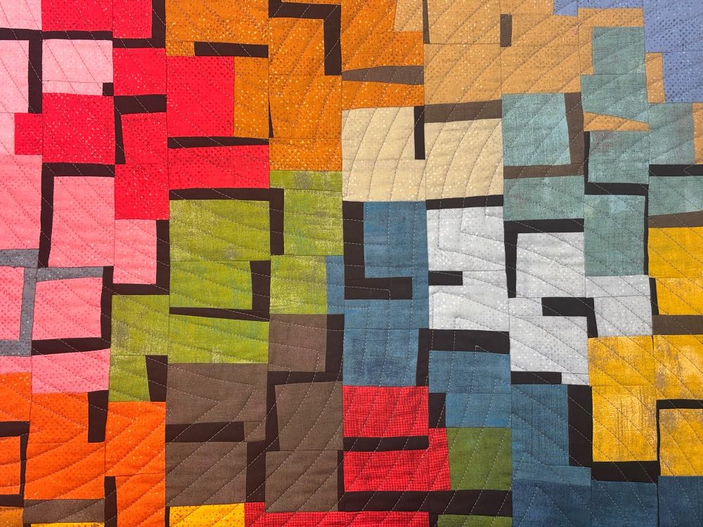 Rectangular-ish shapes in bright colors on a black background