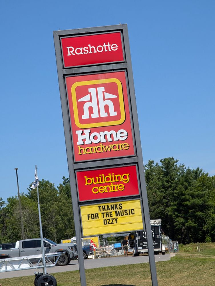 Red & yellow retail sign for Rachotte Home Hardware, with the marquee changed to read, "Thank you for the music Ozzy."