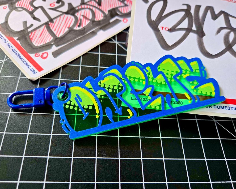 green graffiti keychain that reads ONLINE, by BUGSLAP