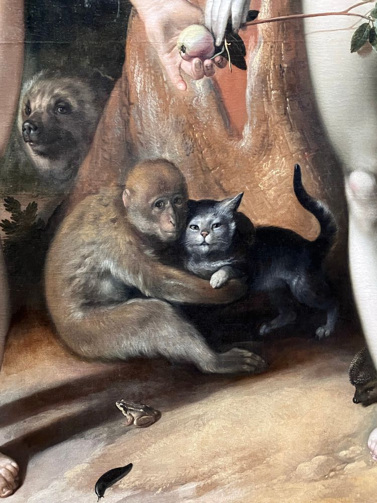 Detail of an oil painting featuring a light brown monkey holding a gray cat