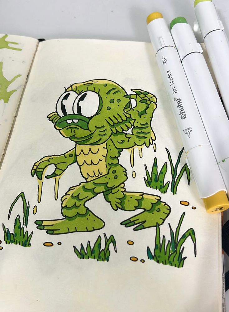 desenho no caderno, arte do Monstro da lagoa em estilo cartoon nas cores verde claro, verde escuro e amarelo 