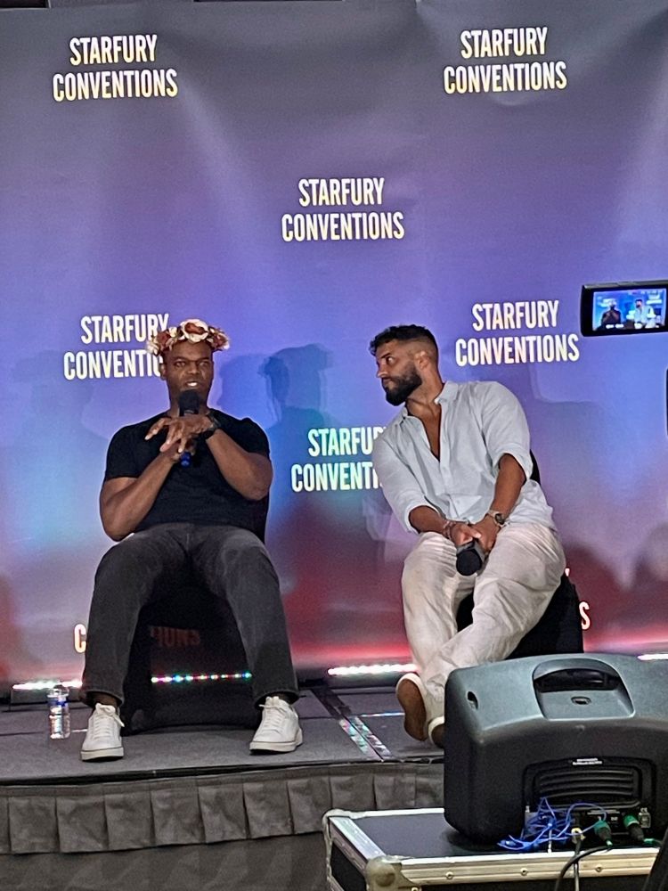 Ricky listening intently to what Demore is saying