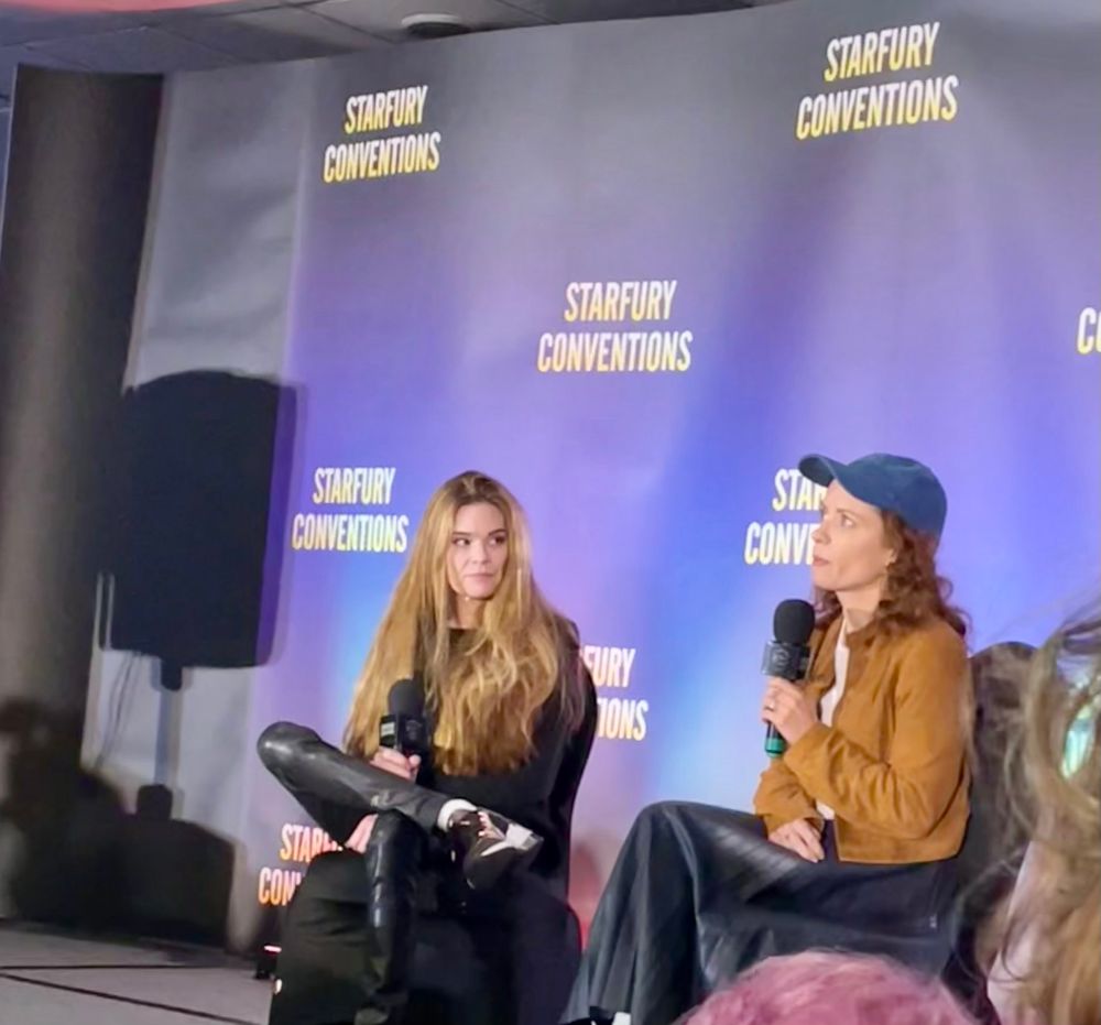 Lara Jean Chorostecki and Ellen Muth seated on stage 