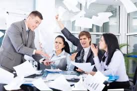 A business meeting that has gone off the rails, people are throwing papers everywhere and gesticulating wildly.