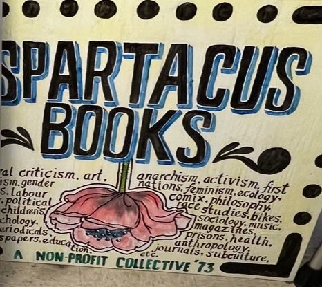 Hand painted sign for Spartacus Books possibly from 1990s-2000s