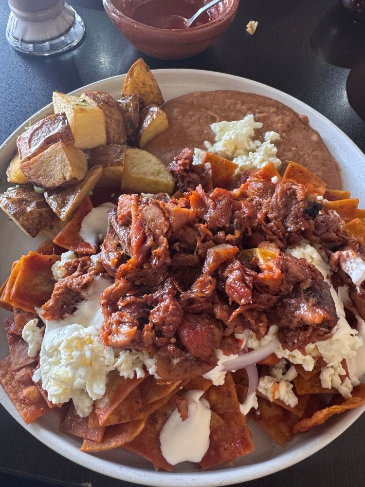 Chilaquiles rojos con chicharron prensado beans and potato