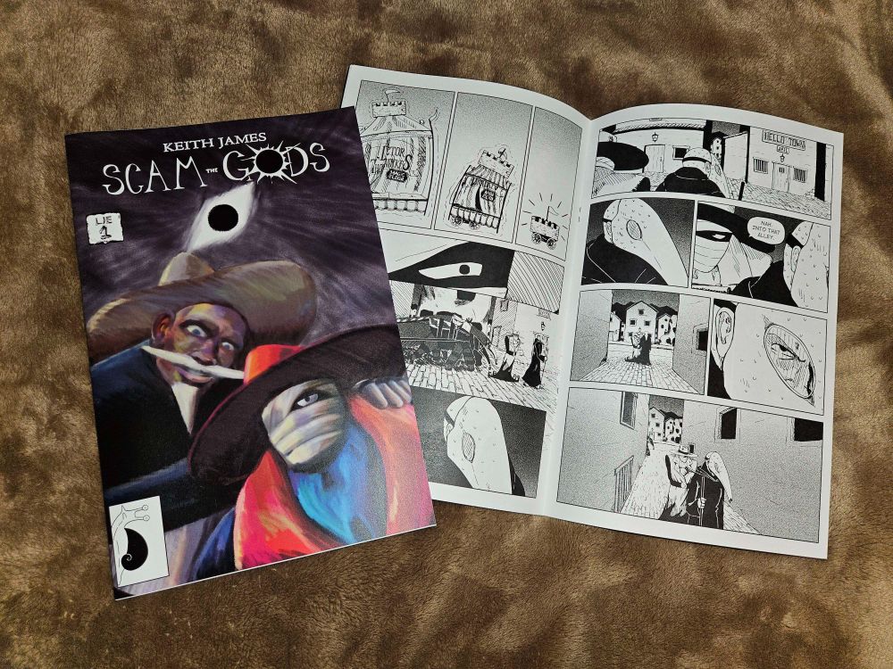 Physical copies of Scam the Gods, Lie 1, one showing the front cover and the other opened to the center page.