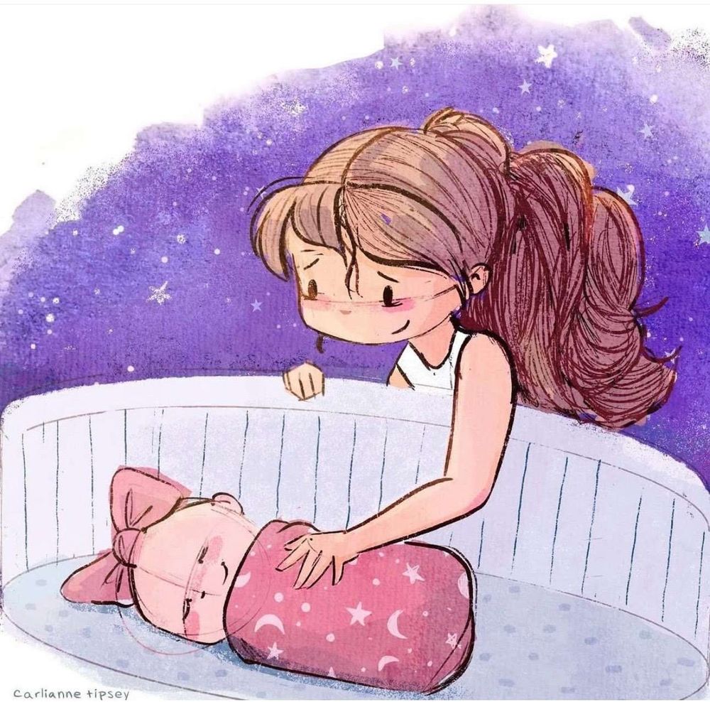 a baby sleeps in a bassinet while an adult looks on adoringly