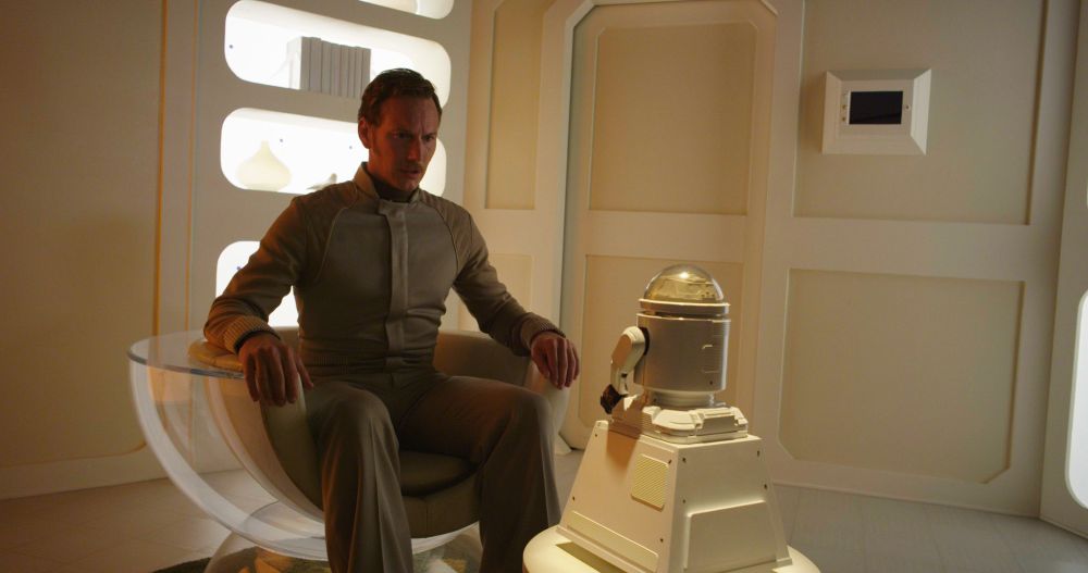 Patrick Wilson sits in a midcentury sci-fi chair in this image from SPACE STATION 76