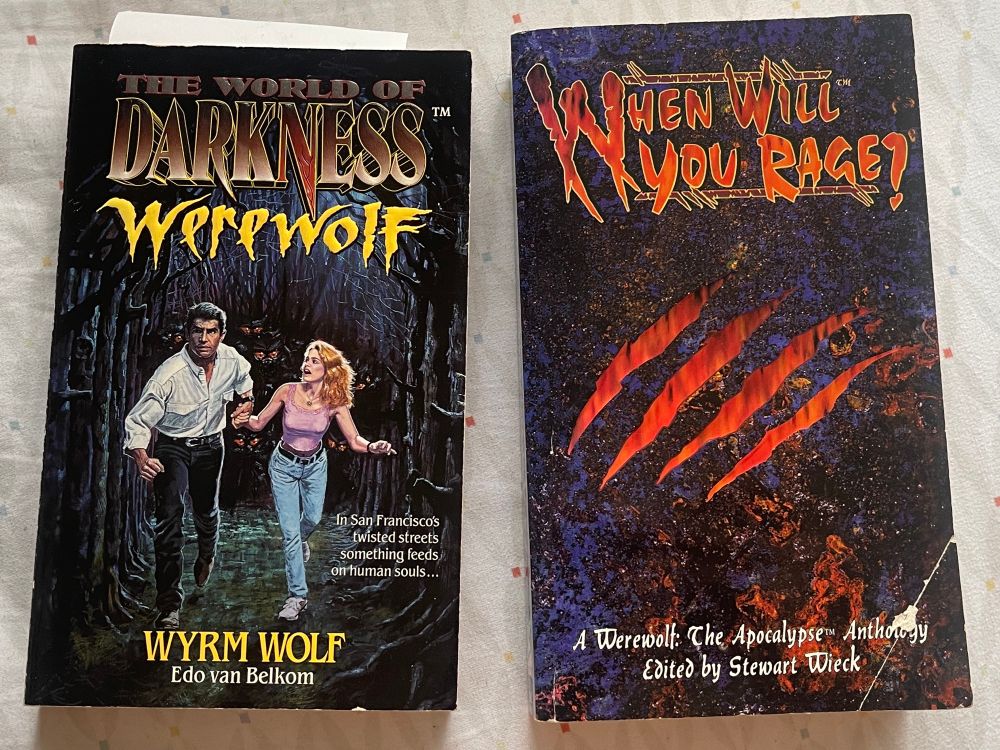 Two World of Darkness Werewolf Books from the 90s. 
Wyrm Wolf by Edo van Belkom. 
When Will You Rage? A Werewolf: The Apocalypse Anthology edited by Stewart Wieck.