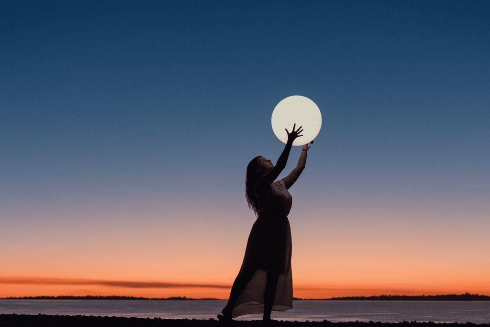 witchy woman holding the moon