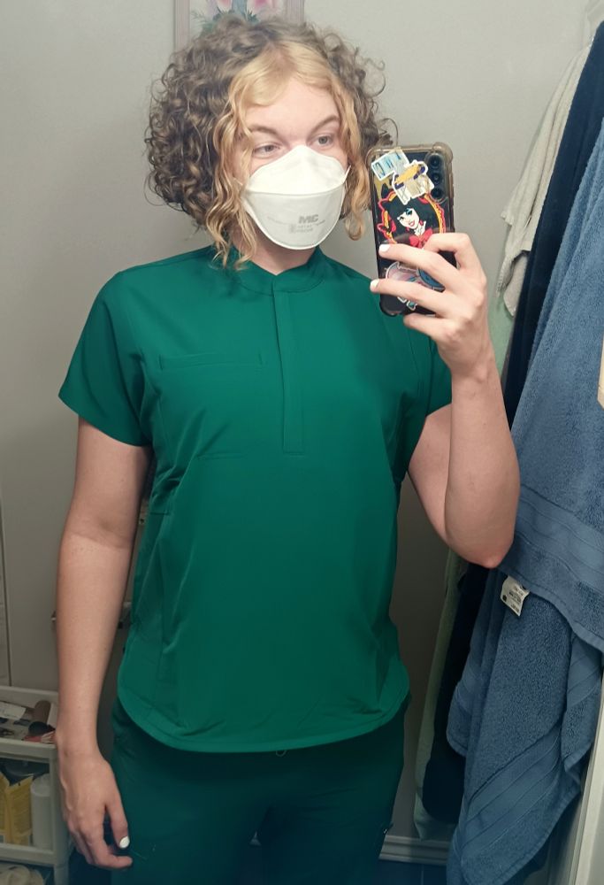 Me in my scrubs again, with the logos removes and I'm wearing an N95