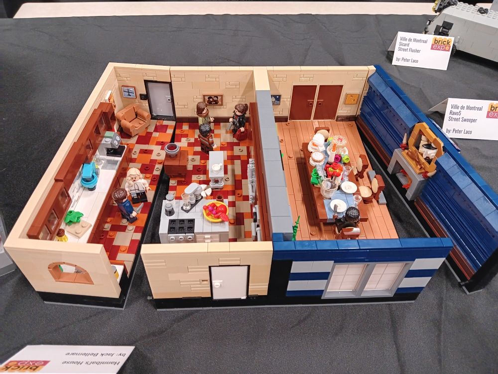 Bird's eye view of Hannibal's kitchen and dining room. The table is set with the Russian dinner from Tome-wan