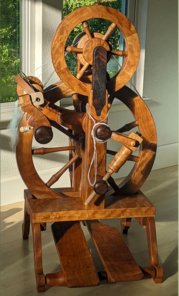Accelerated spinning wheel, for making yarn from fiber.