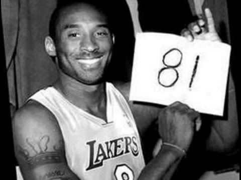 Kobe Bryant holding up 81 on a piece of paper