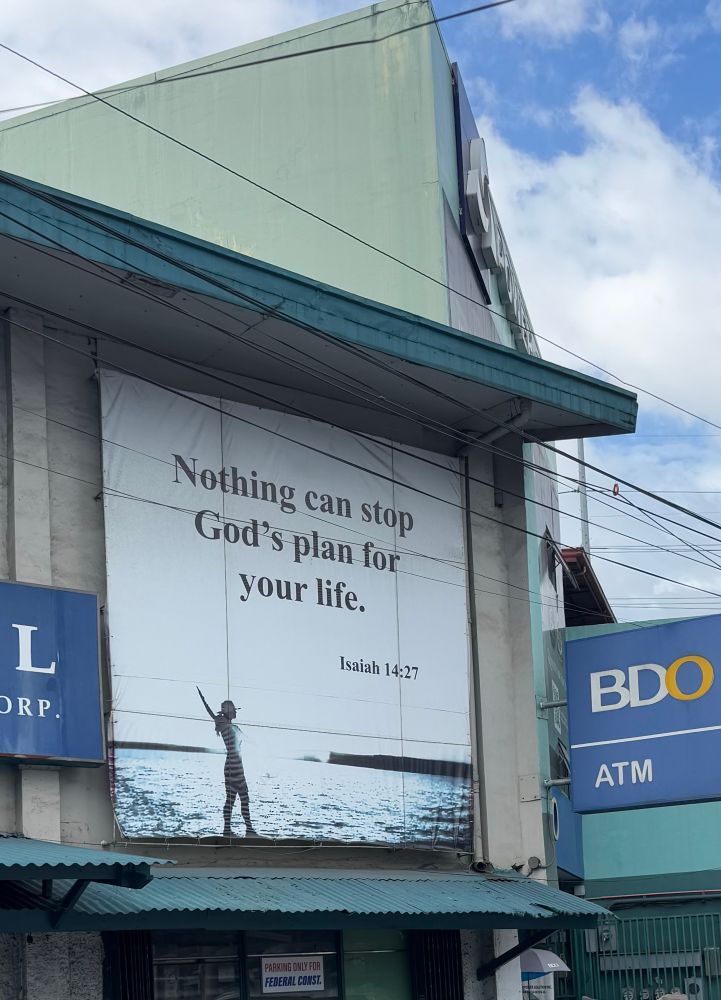 Sign on the side of a building reading: “Nothing can stop God’s plan for your life.”
