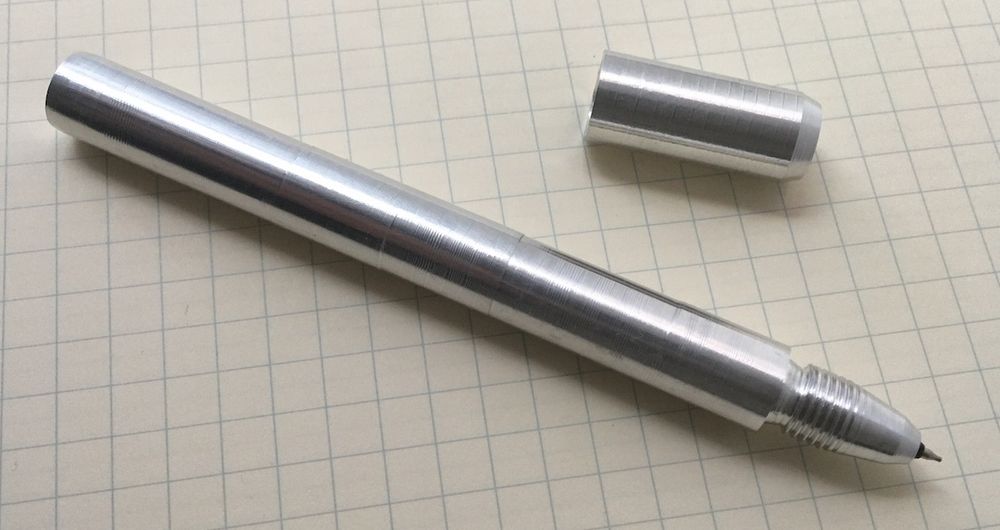 A metal pen, with terrible concentricity and an uncomfortable grip