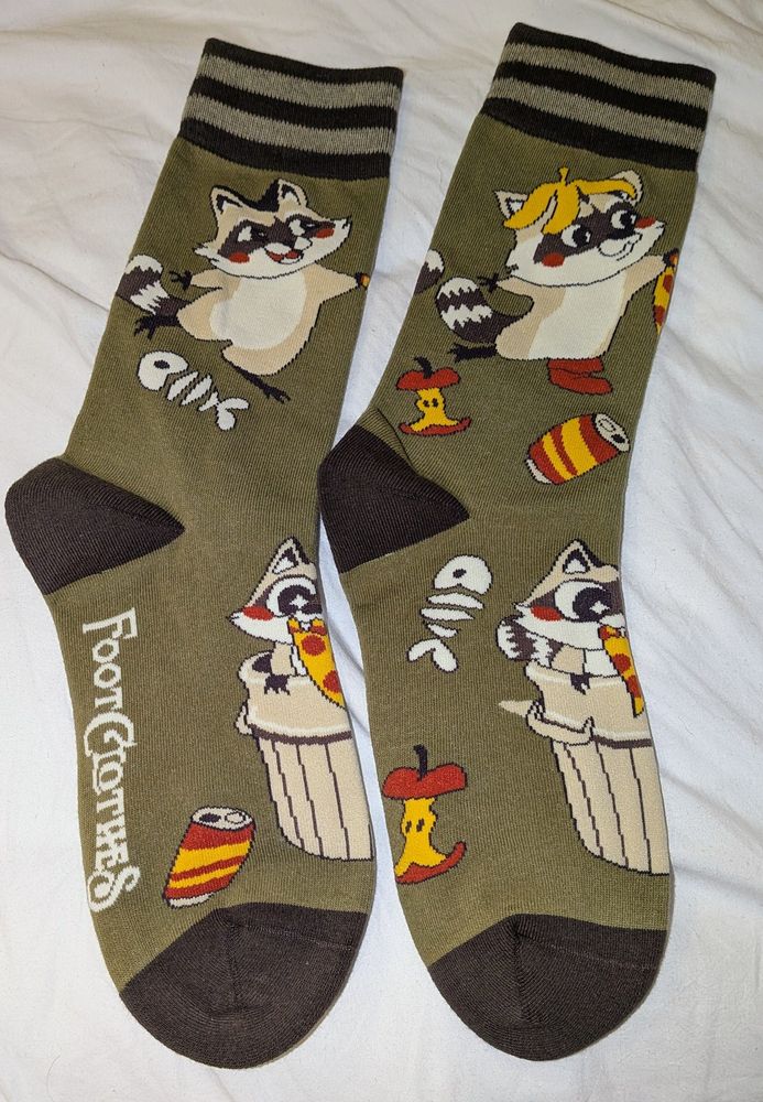 Socks with raccoons on having a pizza and trash party