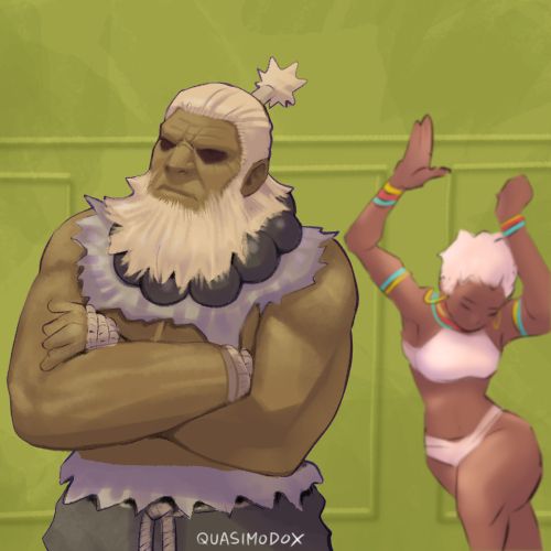 Akuma stands still while Elena dances at the back like Kendrick Lamar's squabble up music video