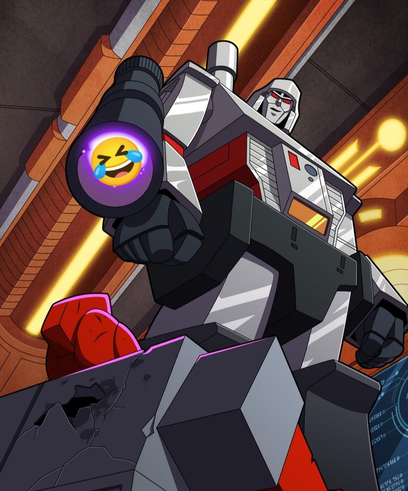 The classic POV shot of Megatron an instant before killing Ironhide from the 1986 transformers movie, but with a laugh emoji in the barrel of his gun.