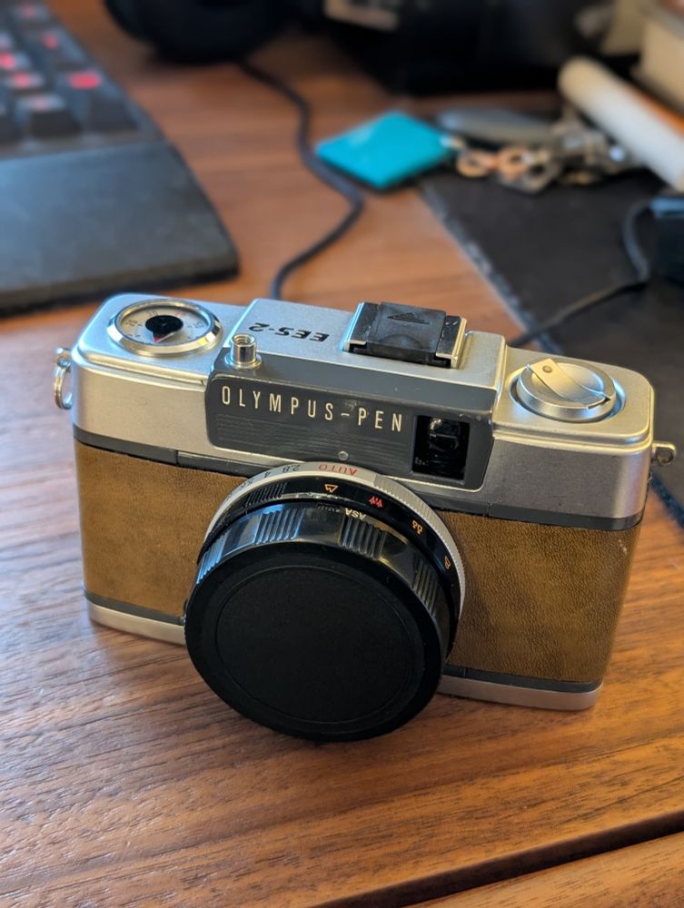 Olympus Pen EES-2 (dear God, that name...) that's been fully refurbished. It's a great half frame camera. 