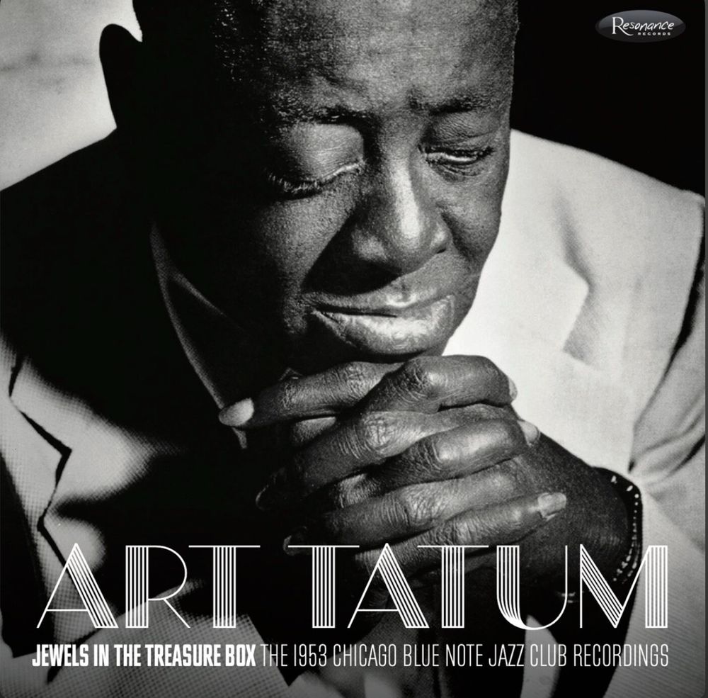 Image is the cover to “Jewels in the treasure box: the 1953 blue note jazz club recordings” Art Tatum box set. The image is Art in closet with eyes closed and clapped hands.
