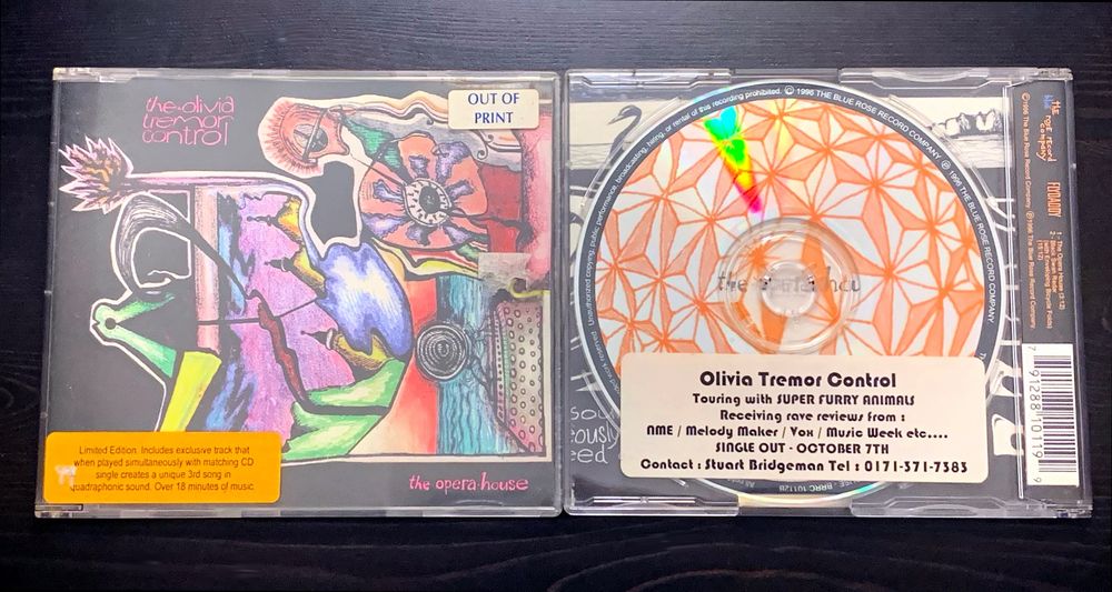 two olivia tremor control cd singles for "the opera house" very psychedelic and colorful