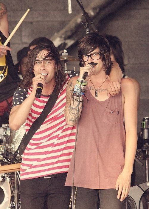 Photo of Vic Fuentes from Pierce The Veil on stage singing with Kellin Quinn from Sleeping With Sirens