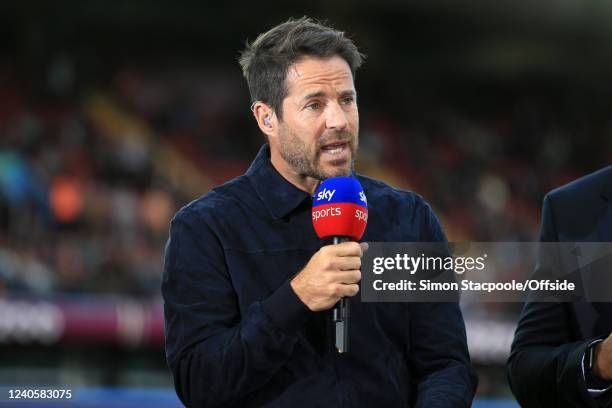 Jamie Redknapp on Sky Sports. Microphone in hand.