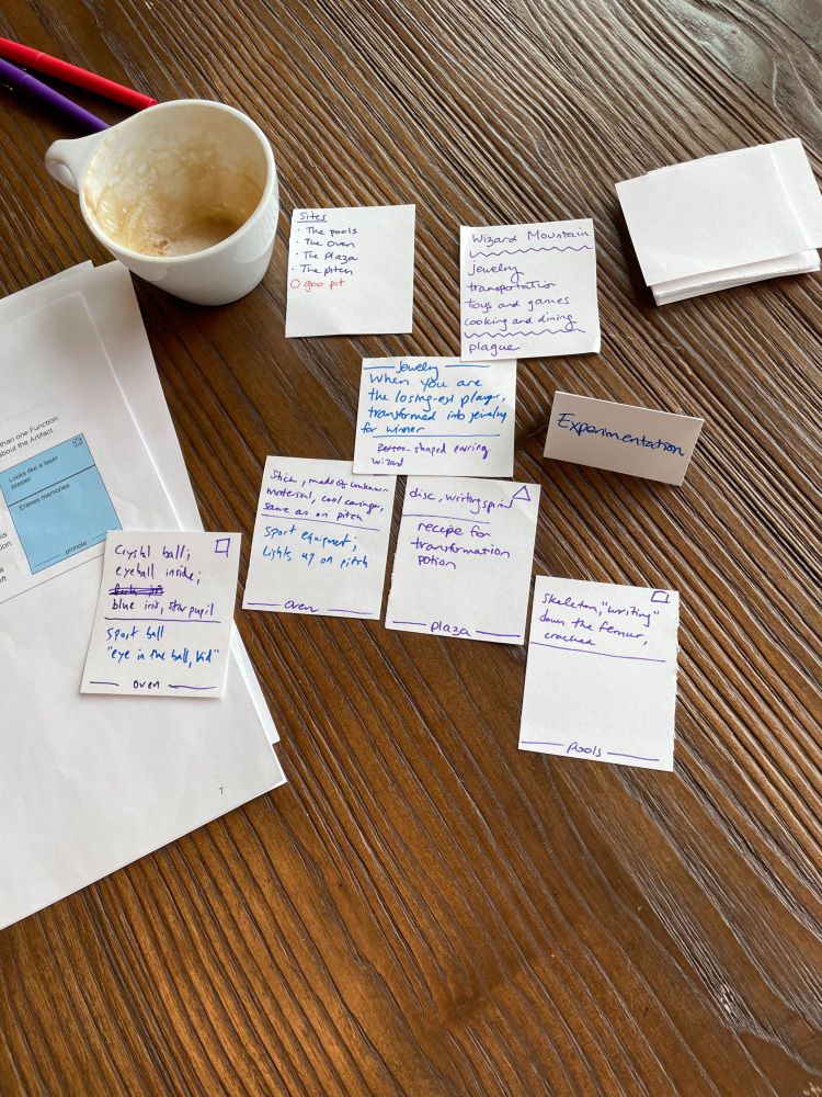 Notecards used in a story game. The topic is the artifacts we found on "Wizard Mountain"