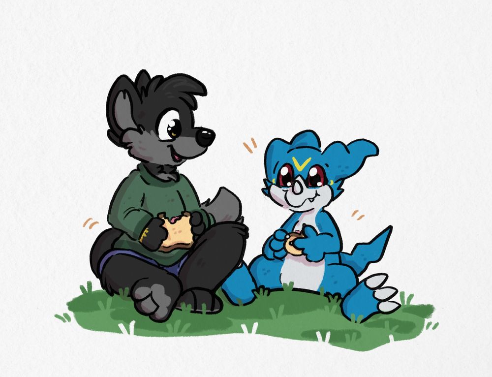 Serge and Veemon sit on the grass eating sandwiches. Serge is a dark grey wolf wearing a green shirt and blue shorts.