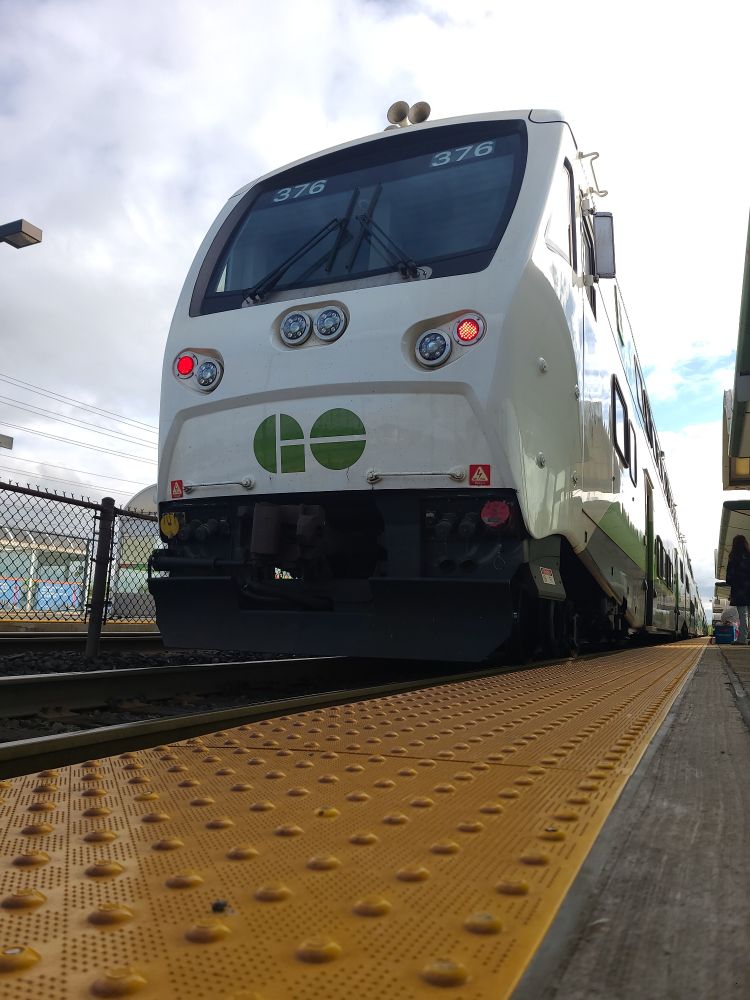 Image of a GO Transit cab car, looking up from the platform floor