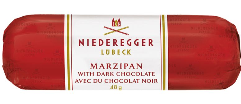 Bar of marzipan wrapped in red foil with a white band in the middle that reads Niederegger / Lubeck / Marzipan / with dark chocolate / avec chocolat noir / 48 g