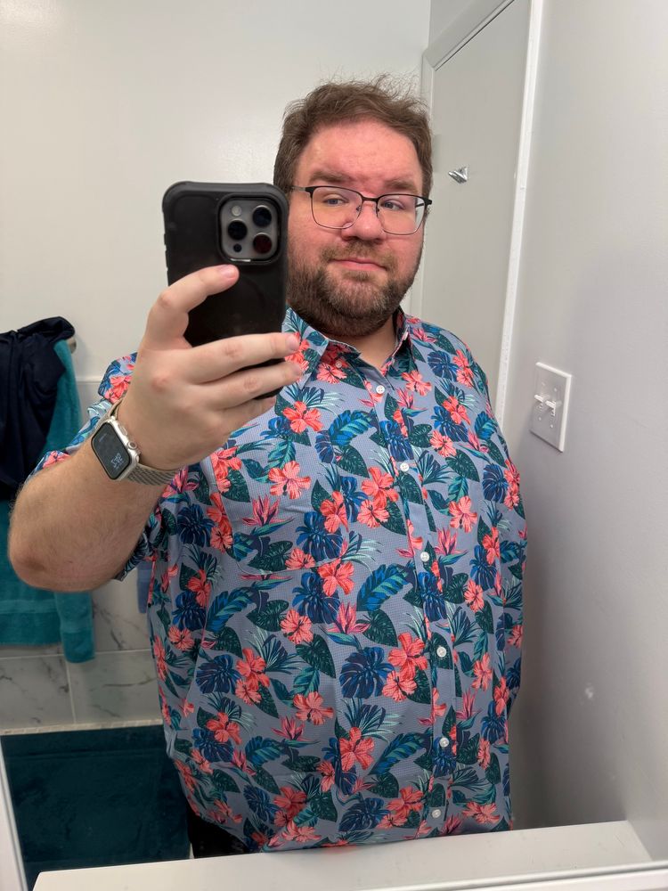 My new shirt that has pink flowers and green leaves