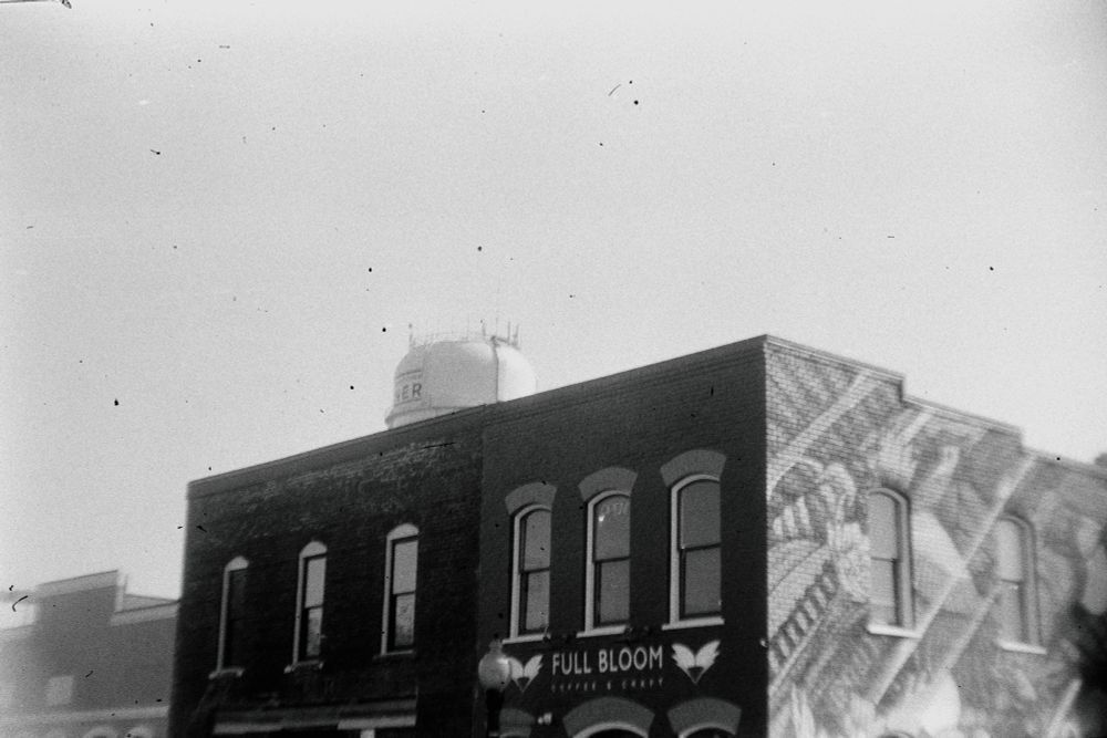 'Full Bloom' is a coffee shop in downtown Garner NC that Terri and I go to often.  You can see the Garner water tower behind the building.  The photograph was made with an Argus A2F, a preWWII 35mm zone focusing camera made by Argus, Ann Arbor MI on Arista EDU 100 film developed in HC110.  