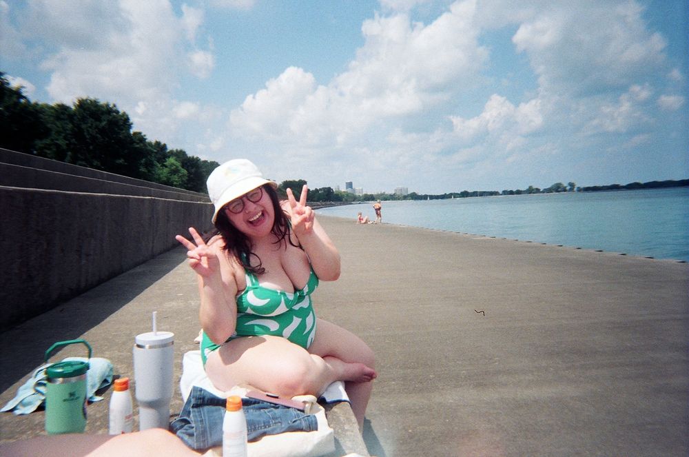 brunette woman in a swimsuit at belmont harbor on lake michigan 
