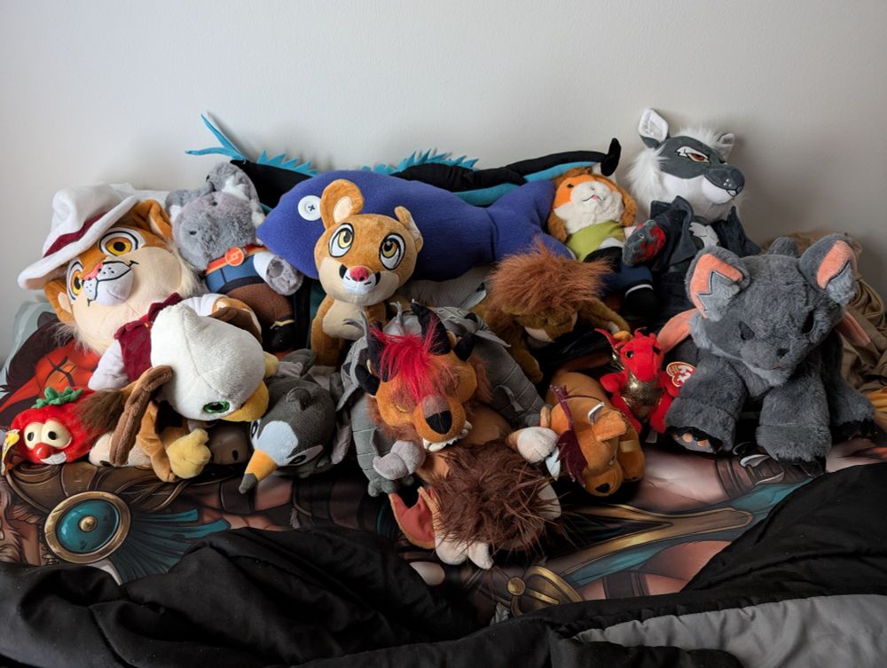 An assortment of pushes, including a Rytlock, Red XIII, World of Warcraft gryphon and windrider, a few from Megaplex, among others.