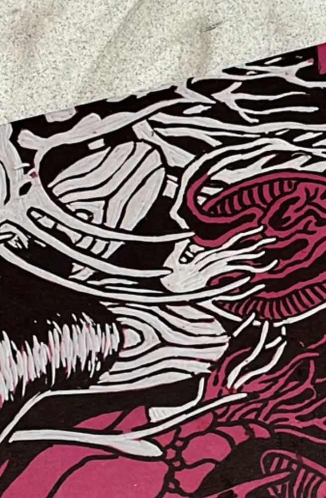 partially carved linoleum block of some fish