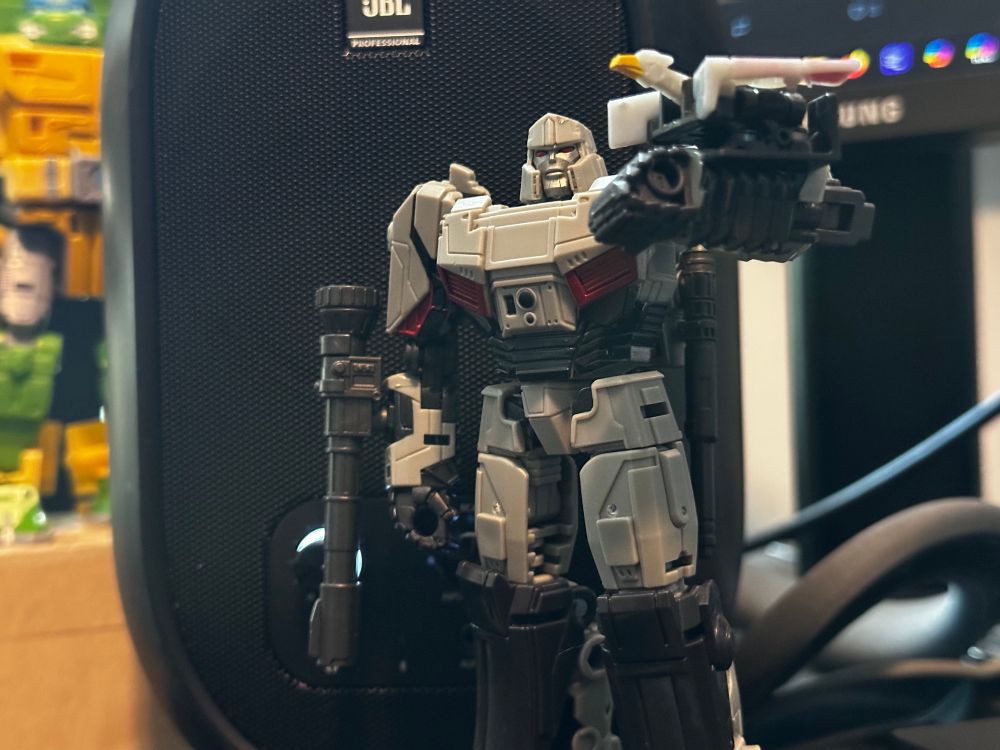 Megatron, holding Lazerbeak on his forearm