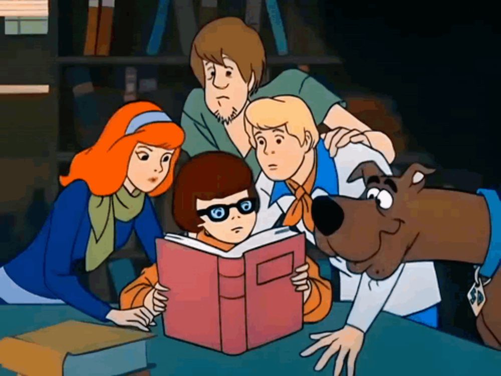 scooby doo and his friends read a book together