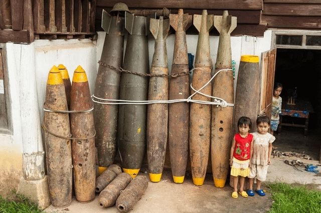 Image of children standing next to US bombs from : https://www.reddit.com/r/interestingasfuck/comments/r9mxih/size_of_outer_shells_and_inner_cluster_bombs_of/?rdt=48755