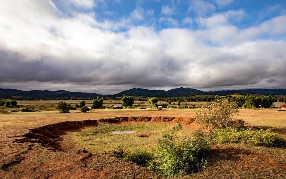 Bomb craters in Laos from: https://lifepart2andbeyond.com/video-forty-years-after-the-carpet-bombing/