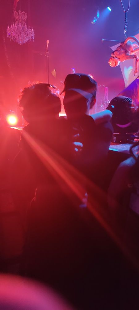 Ohgr of Skinny PUppy jumping off stage to bear hug my son after he was holding his hand up for a fist bump. After Ohgr ran off stage and came back with a tour hat for him. 🥰